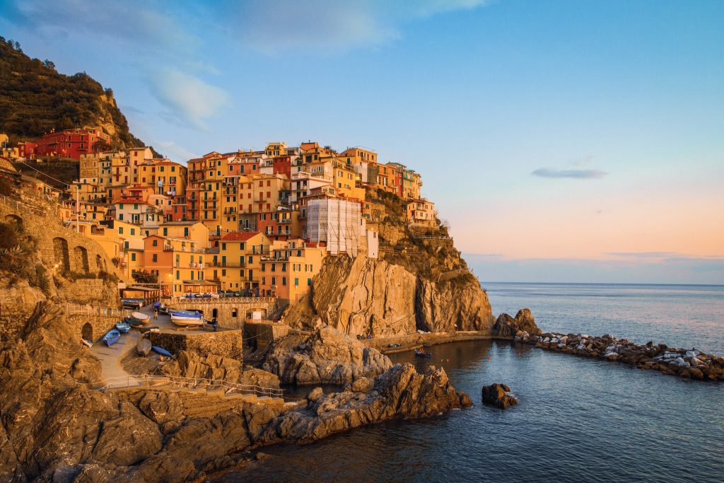 Picture of Manarola village at the sunset. Showing the cliff and the sea.